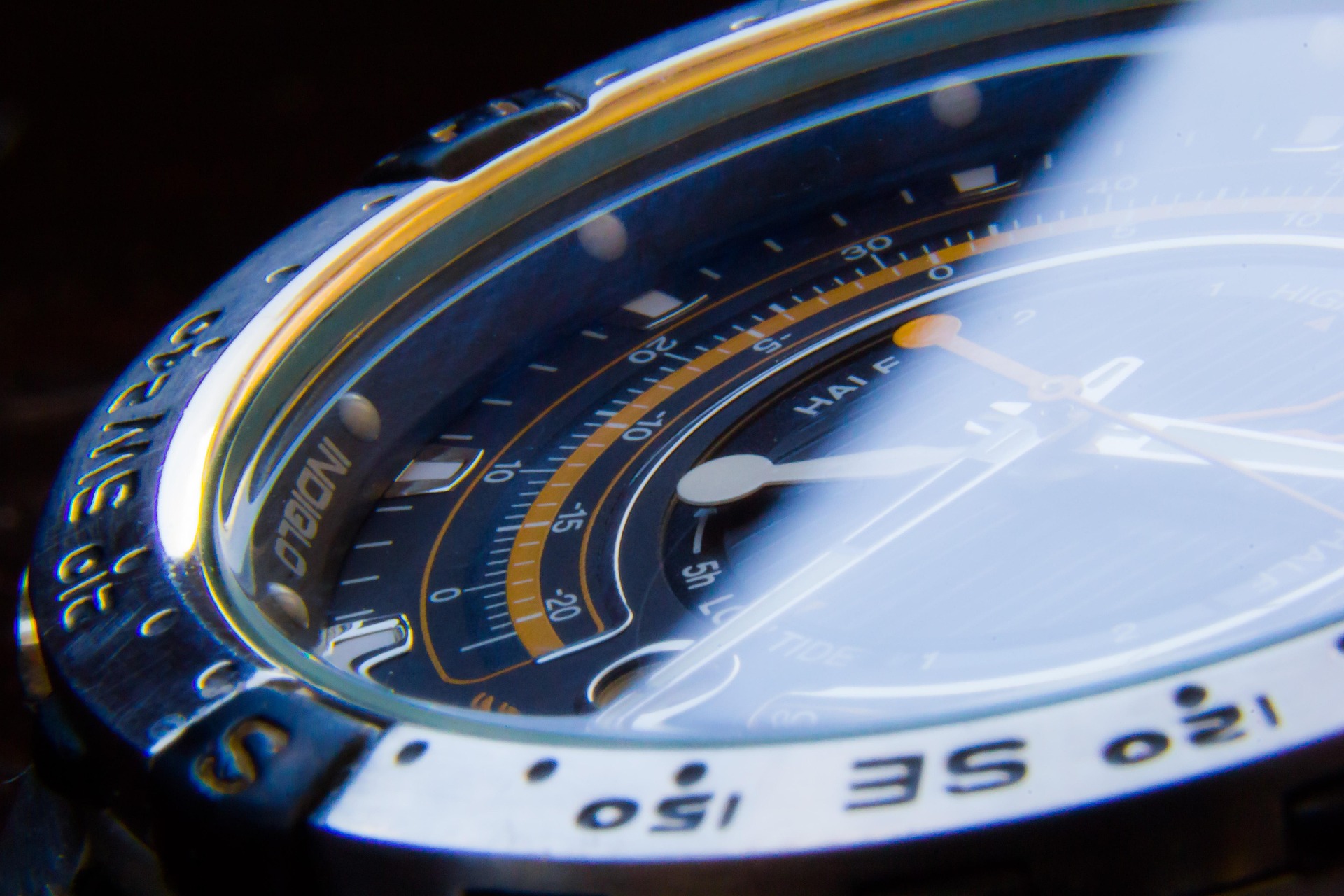 Macro close-up of an illuminated watch dial showing intricate detail